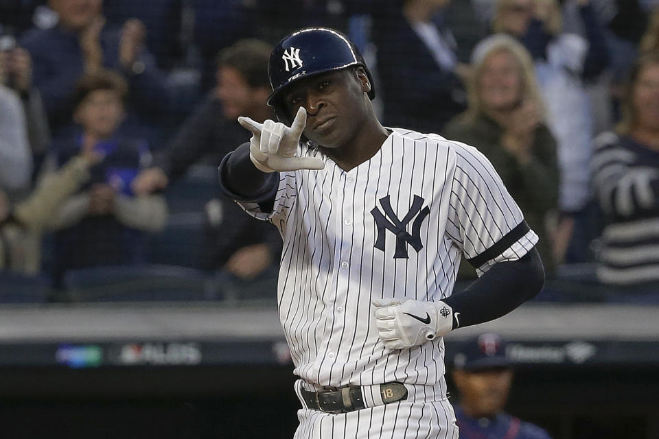 New York Yankees' Didi Gregorius motions as he crosses the plate after hitting a grand slam home run against the Minnesota Twins during the third inning of Game 2 of an American League Division Series baseball game, Saturday, Oct. 5, 2019, in New York. (AP Photo/Seth Wenig)