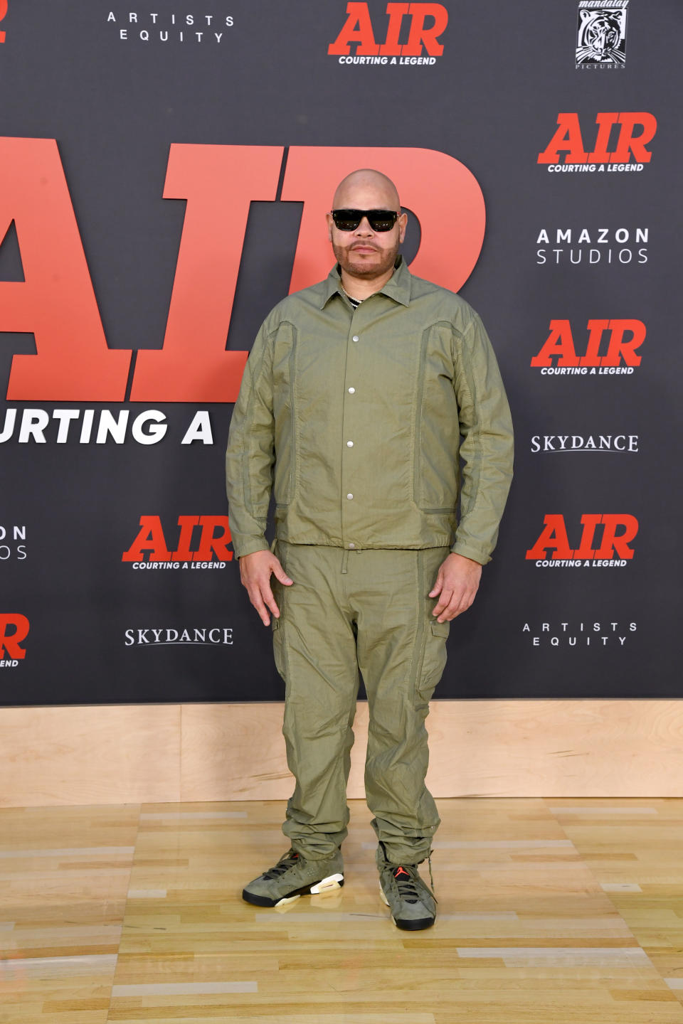 Fat Joe wearing green outfit. 