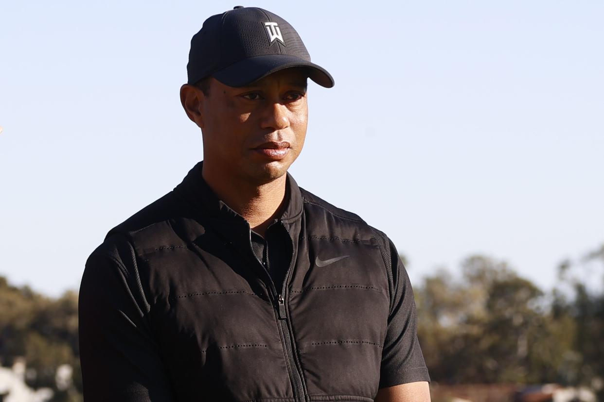 Tiger Woods looks on during the trophy ceremony on the practice green after the final round of the Genesis Invitational golf tournament at Riviera Country Club, Sunday, Feb. 21, 2021, in the Pacific Palisades area of Los Angeles.