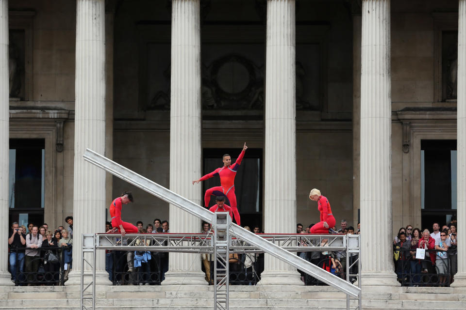 LONDON, ENGLAND - JULY 15: Dancers perform a routine in front of the National Gallery in Trafalgar Square as part of the 'One Extraordinary Day' performances on July 15, 2012 in London, England. The dancers are part of American choreographer Elizabeth Streb's 'Extreem Action' dance group which will perform around London for one day only and form part of the Cultural Olympiad. (Photo by Dan Kitwood/Getty Images)