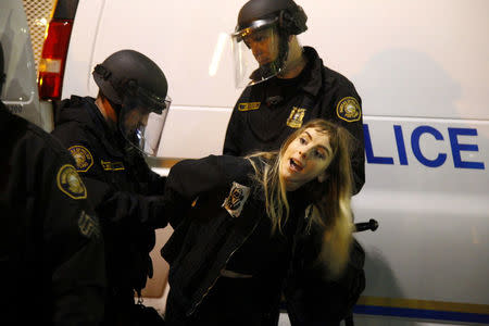 Police detain a demonstrator during a protest against the election of Republican Donald Trump as President of the United States in Portland, Oregon, U.S. November 10, 2016. REUTERS/Steve Dipaola