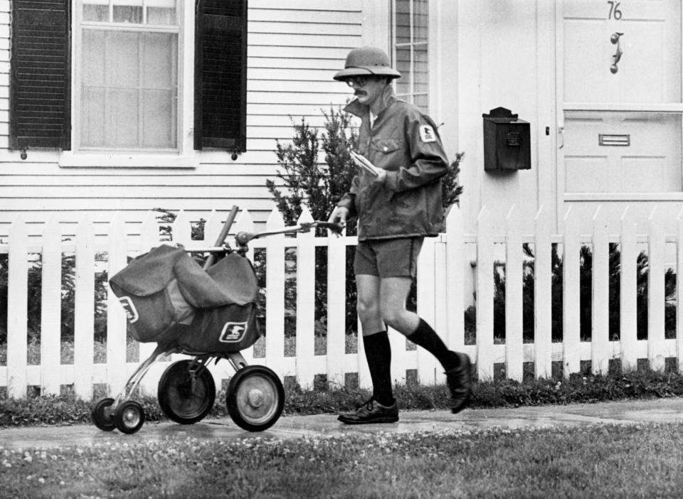 A United States Postal Service worker in Exeter, New Hampshire, June 25, 1981.