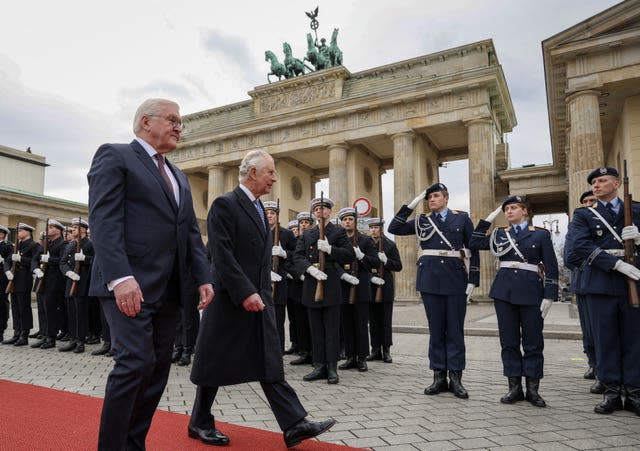 German President Frank-Walter Steinmeier (left) and the King inspect a guard of honour during the ceremonial welcome at Brandenburg Gate, Berlin 