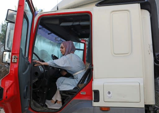 Palestinian Dalia al-Darawish prepares for her exam to become a truck driver in the West Bank town of Hebron