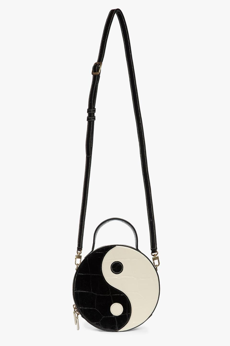 The Yin Yang Bag is a structured leather bag that can be carried by hand or over the shoulder with the detachable strap. ($350)