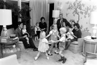 Not originally published in LIFE. Michigan governor George Romney (seated on couch at right) with family, November 1963. Mitt Romney is seated at left. (Francis Miller—Time & Life Pictures/Getty Images) <br> <br> <a href="http://life.time.com/history/mitt-romney-photos-from-the-gop-candidates-early-years/#1" rel="nofollow noopener" target="_blank" data-ylk="slk:Click here to see the full collection at LIFE.com;elm:context_link;itc:0;sec:content-canvas" class="link ">Click here to see the full collection at LIFE.com</a>