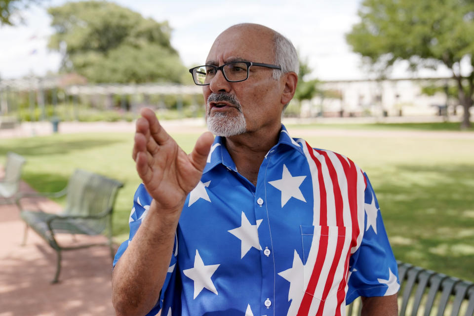 Mo Saiidi, chairmen of the Gillespie County GOP, speaks outside the County court house Wednesday, Aug. 17, 2022, in Fredericksburg, Texas. On the brink of November's midterm elections, both full-time election workers in rural Gillespie County suddenly and stunningly quit this month with less than 70 days before voters start casting ballots. (AP Photo/Eric Gay)