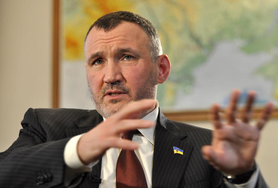 Ukraine's Deputy Prosecutor General Renat Kuzmin speaks during an interview with Associated Press in Kiev, Ukraine, Wednesday, March 14, 2012. Kuzmin charged that a firm controlled by jailed former Prime Minister Yulia Tymoshenko paid for the contract-style killing of alawmaker and businessman in 1996, further decreasing the likelihood that Tymoshenko would be released from jail any time soon. (AP Photo/Sergei Chuzavkov)