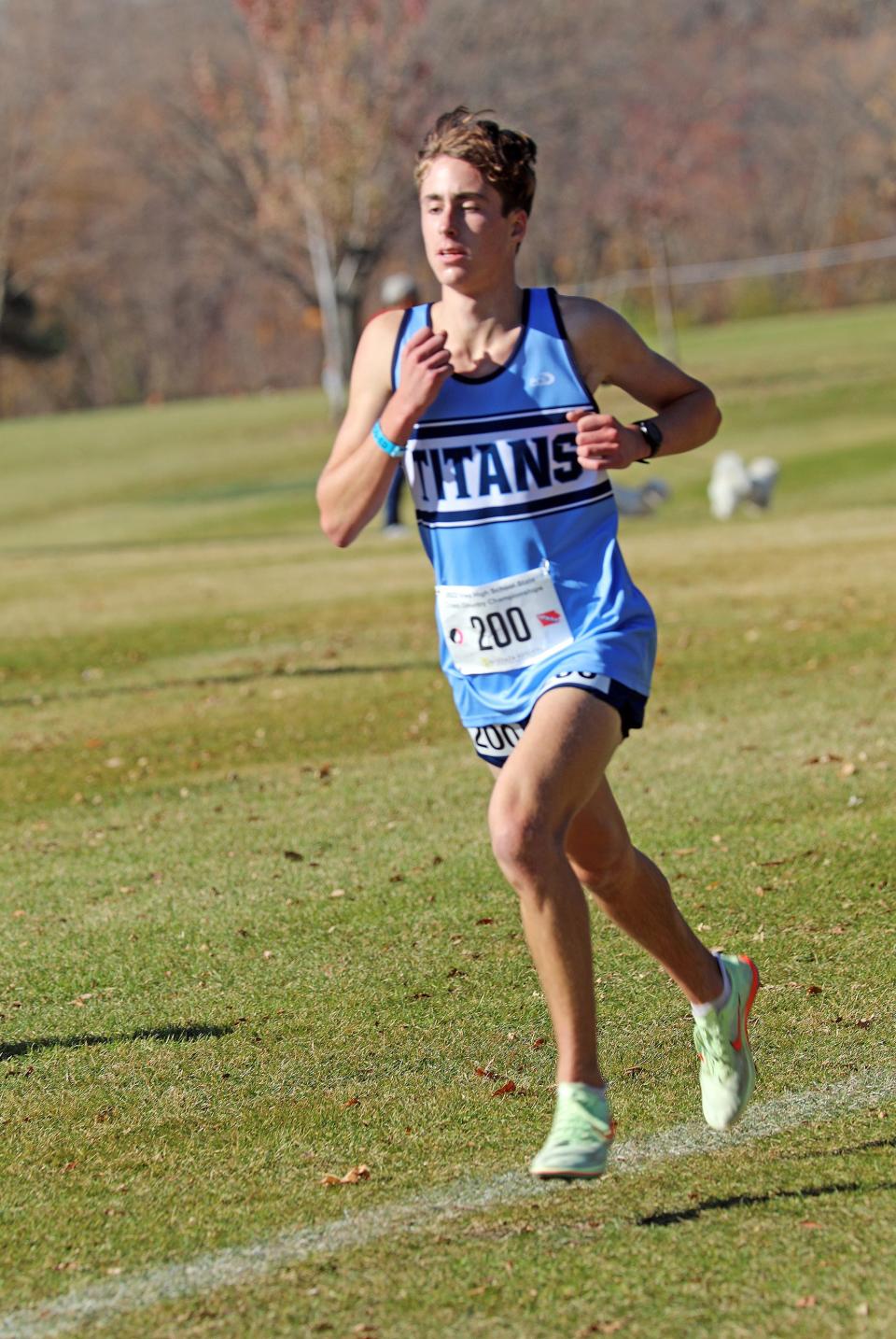 Lewis Central junior Ethan Eichhorn (200) runs in second place during the State Cross Country Class 3A Boys 5K race at the Lakeside Municipal Golf Course in Fort Dodge. 