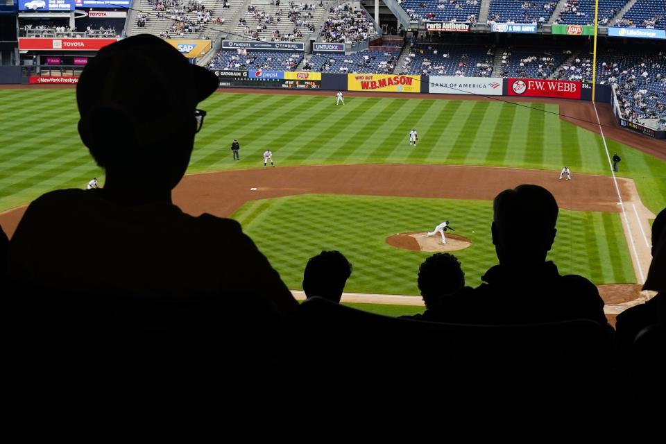 Fans watch during the third inning of a baseball game between the New York Yankees and the Tampa Bay Rays at Yankee Stadium on Tuesday, June 1, 2021, in New York. (AP Photo/Frank Franklin II)