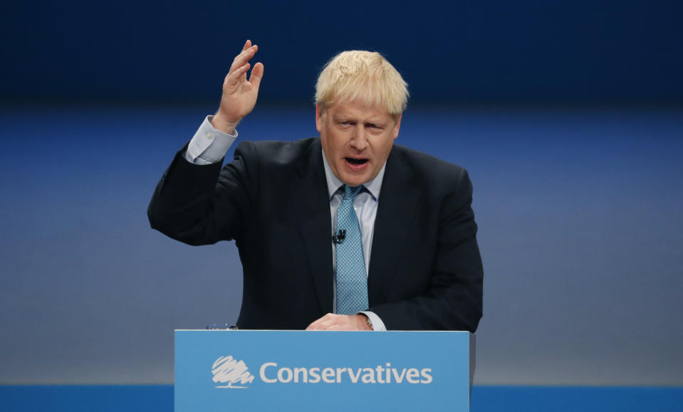 Britain's Prime Minister Boris Johnson delivers his Leader's speech at the Conservative Party Conference in Manchester, England, Wednesday, Oct. 2, 2019. Britain's ruling Conservative Party is holding their annual party conference. (AP Photo/Frank Augstein)