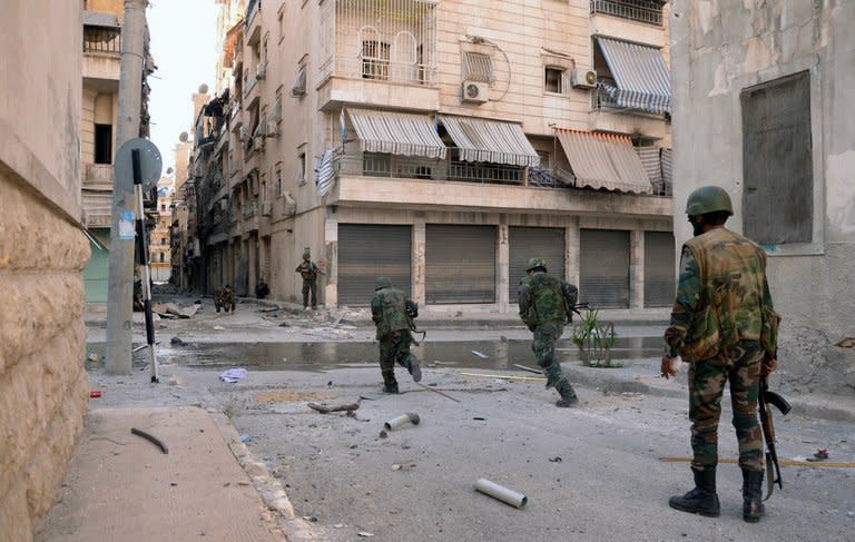 Syrian forces in the Suleiman al-Halabi nieghbourhood on Aleppo, on October 30, 2012. Iranian Foreign Minister Ali Akbar Salehi has said Bashar al-Assad will take part in Syria's next presidential election in 2014