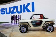 Models present Suzuki Motor's EV e-Survivor concept during media preview of the 45th Tokyo Motor Show in Tokyo, Japan October 25, 2017. REUTERS/Kim Kyung-Hoon