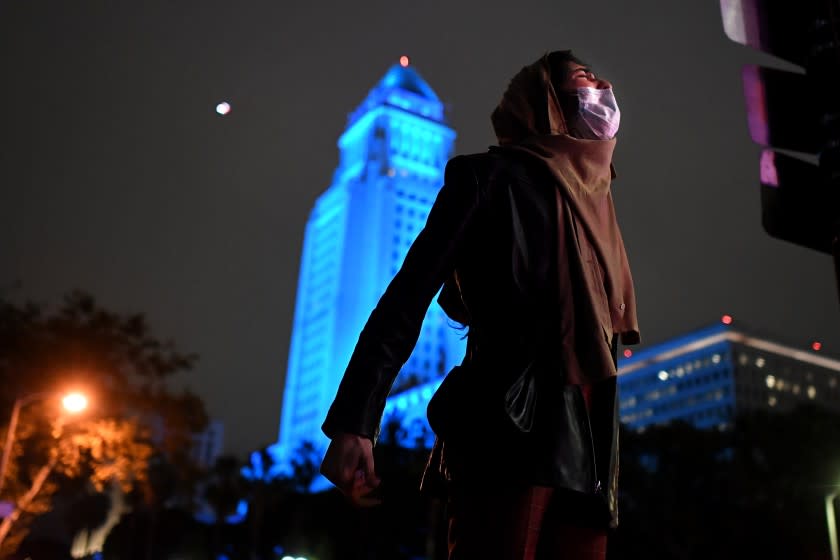 LOS ANGELES, CALIFORNIA MAY 29, 2020-A protestor yells out along 2nd and Spring streets in Downtown Los Angeles Friday. Protestors marches across the nation after the death of George Floyd. (Wally Skalij/Los Angeles Times)