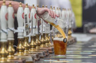 <p>A pint is poured into a pitcher at the Great British Beer Festival, August 8, 2017 in London, England. (Photo: Amer Ghazzal/REX/Shutterstock) </p>