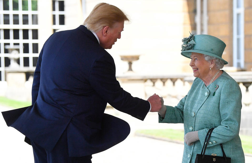 Queen Elizabeth II shakes hands with US President Donald Trump during a welcome ceremony at Buckingham Palace