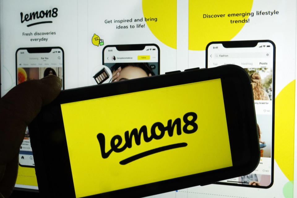 This photo shows the logo and application page for the social media site Lemon8, in New York, Wednesday, April 5, 2023. Lemon8, is a photo-based app that could be described as a mixture of Instagram and Pinterest with sprinkles of videos that resemble those posted on TikTok. It launched in Asian markets in 2020 and has already made headway in countries like Thailand and Japan. (AP Photo/Richard Drew)