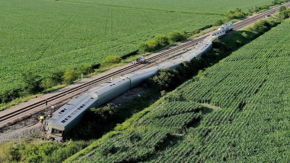 An Amtrak train lies alongside the track Monday after the crash in Mendon, about two hours northeast of Kansas City.