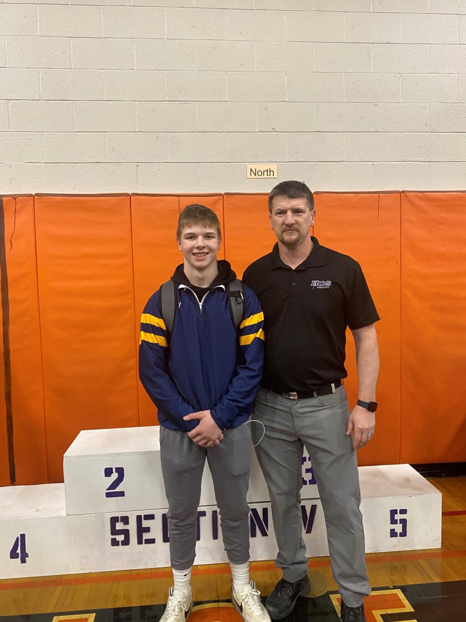 Noah Leitten, a junior at Perry, with Section V wrestling committee member Dan Conley after the Section V Class B3 Championships. Leitten won the 160-pound title after he pinned all of his opponents.