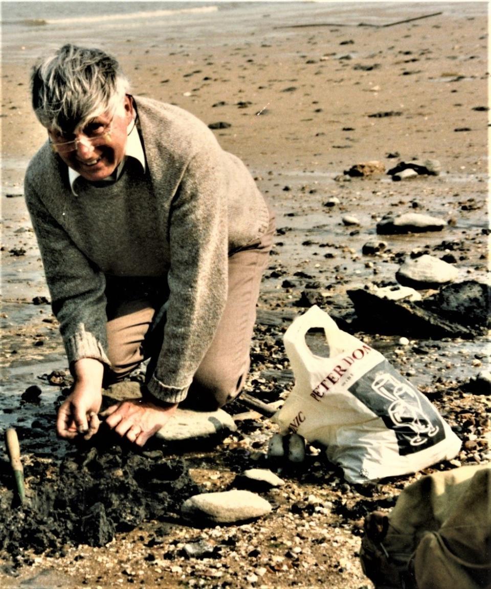 Michael Daniels with a  fossil (Stewart Attwood/National Museums Scotland/PA)