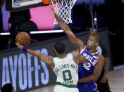 Boston Celtics forward Jayson Tatum (0) shoots as Philadelphia 76ers forward Al Horford (42) defends during the first quarter of Game 4 of an NBA basketball first-round playoff series, Sunday, Aug. 23, 2020, in Lake Buena Vista, Fla. (Kim Klement/Pool Photo via AP)