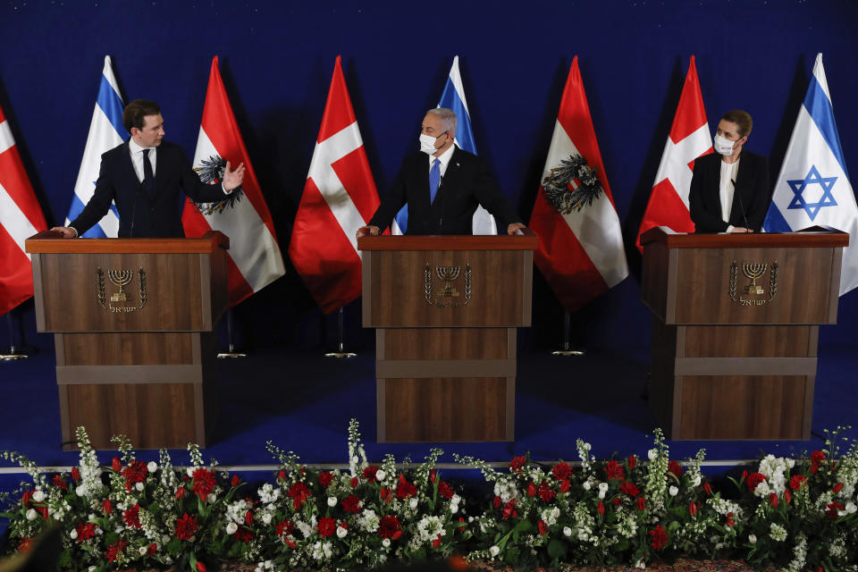 Israeli Prime Minister Benjamin Netanyahu, center, Danish Prime Minister Mette Frederiksen, left, and Austrian Chancellor Sebastian Kurz, right, speak during a joint statement at the Israeli Prime minister office in Jerusalem, on Thursday, March 4, 2021. (Olivier Fitoussi/Pool Photo via AP)