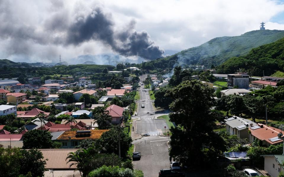 Smoke can be seen in the distance as a result of the riots in Noumea