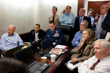U.S. President Barack Obama (2nd L) and Vice President Joe Biden (L), along with members of the national security team, receive an update on the mission against Osama bin Laden in the Situation Room of the White House, in this May 1, 2011 file picture. REUTERS/White House/Pete Souza/Handout via Reuters/Files