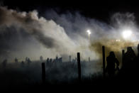 <p>Police tear gas protesters during a protest against plans to pass the Dakota Access pipeline near the Standing Rock Indian Reservation, near Cannon Ball, N.D., on Nov. 20, 2016. (Stephanie Keith/Reuters) </p>