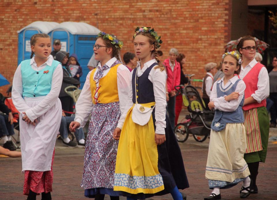 Girls walk down Main Street in Lindsborg dressed in costume during the 2017 Grand Parade at Svensk Hyllningsfest. This year's festival, which celebrates the Swedish heritage of the Smoky Valley region, takes place on Oct. 13 and 14.