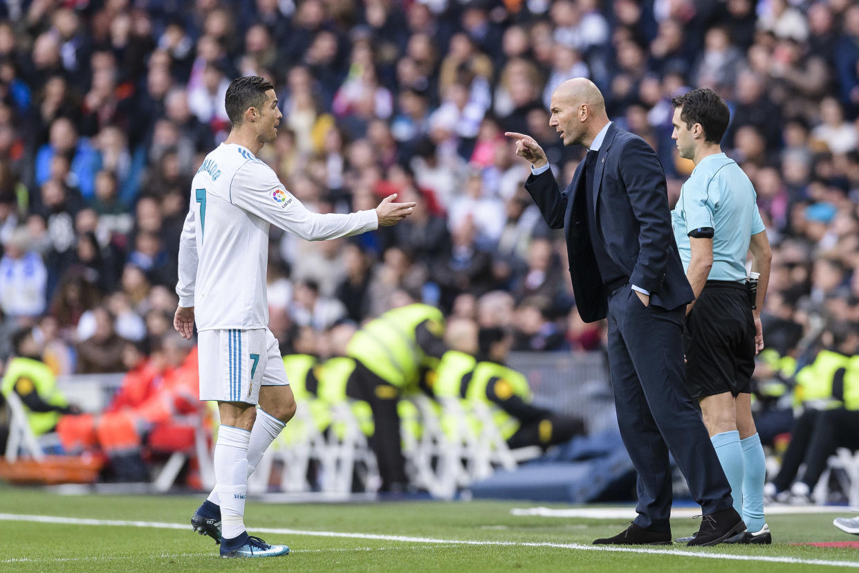 MADRID, SPAIN - DECEMBER 09: Zinedine Zidane Head Coach of Real Madrid (R) instructs Cristiano Ronaldo of Real Madrid (L) during La Liga 2017-18 match between Real Madrid and Sevilla FC at Santiago Bernabeu Stadium on 09 December 2017 in Madrid, Spain. (Photo by Power Sport Images/Getty Images)