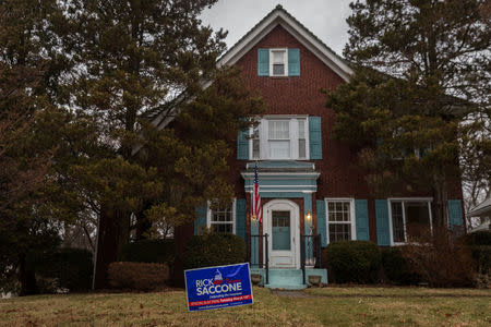 A yard sign showing support for Congressional candidate Rick Saccone is seen at a residence in Upper St. Clair, Pennsylvania, U.S., February 15, 2018. Picture taken February 15, 2018. REUTERS/Maranie Staab