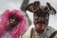 <p>A man dressed as a zombie participates in a walk for World Zombie Day 2017 on Place de la République in Paris, France, Oct.7, 2017. More than 50 cities worldwide participate in the worldwide horror festival in which revellers dress up as zombie-related characters. (Photo: EFE/EPA/IAN LANGSDON) </p>