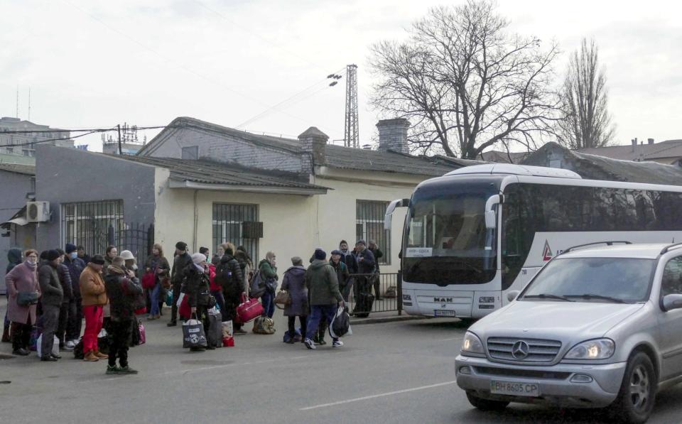 Citizens queue to get on a bus. Early on February 24, President Putin announced a special military operation to be conducted by the Russian Armed Forces in response to appeals for help from the leaders of the Donetsk and Lugansk People's Republics - Everyday life in Odessa, Ukraine 