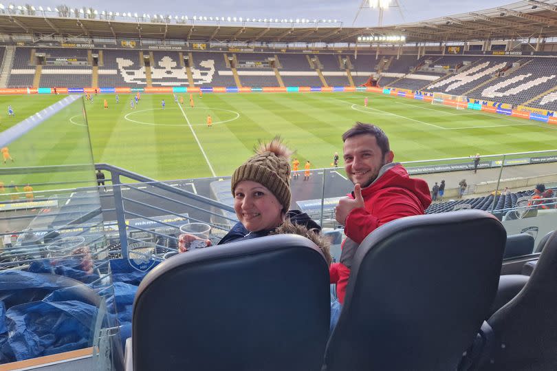 Julia and her boyfriend Szymon watch the KCOM annual staff match at the MKM Stadium, in Hull