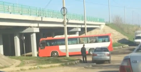 A still image from a video footage taken on April 6, 2018 shows a bus transferring Russian private military contractors passing a checkpoint before entering the Defence Ministry base in Molkino near Krasnodar, Russia. REUTERS/Stringer