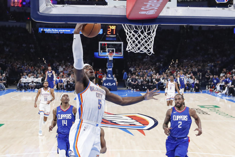 Feb 22, 2024; Oklahoma City, Oklahoma, USA; Oklahoma City Thunder guard Luguentz Dort (5) goes to the basket against the LA Clippers during the second half at Paycom Center. Mandatory Credit: Alonzo Adams-USA TODAY Sports