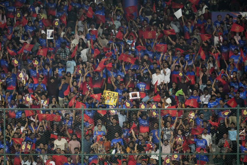 Spectators react after Royal Challengers Bengaluru's Virat Kohli hit a boundary during the Indian Premier League cricket match between Royal Challengers Bengaluru and Kolkata Knight Riders in Bengaluru, India, Friday, March 29, 2024. (AP Photo/Aijaz Rahi)