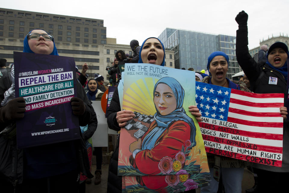 A group hold up signs at freedom plaza during the women’s march in Washington on Saturday, Jan. 19, 2019. (Photo/Jose Luis Magana/AP)