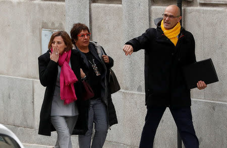 Catalan politicians (L-R) Carme Forcadell, Dolors Bassa and Raul Romeva arrive together to the Supreme Court after being summoned and facing investigation for their part in Catalonia's bid for independence in Madrid, Spain, March 23, 2018. REUTERS/Juan Medina