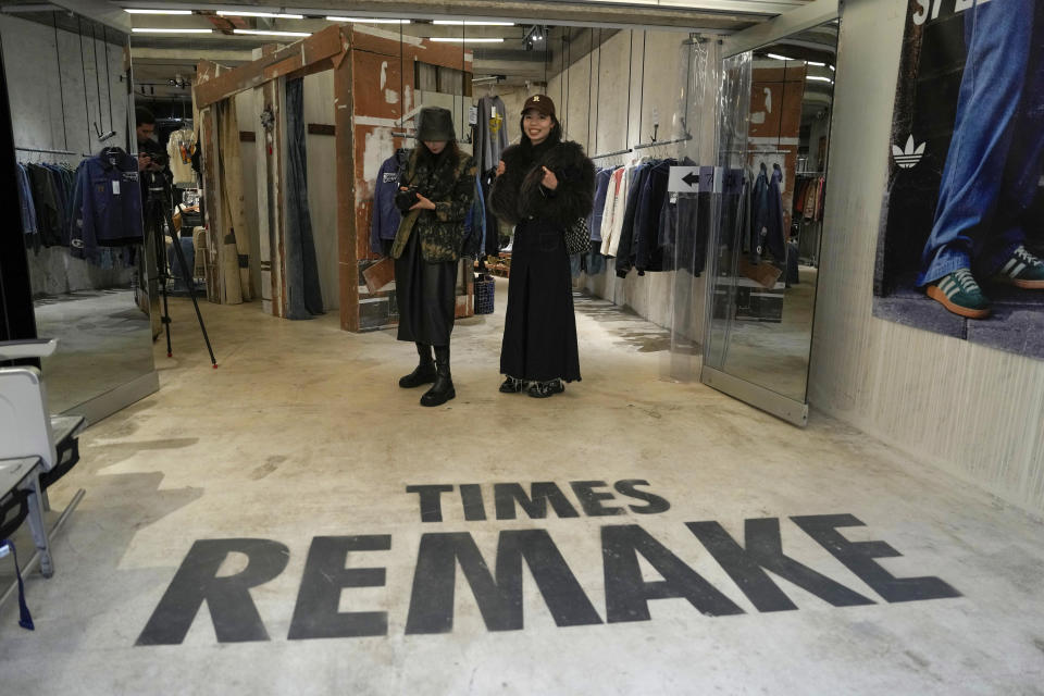 Customers visit a store for Times Remake, a Shanghai-based brand that takes secondhand clothes and refashions them into new garments in Shanghai on March 18, 2024. (AP Photo/Ng Han Guan)