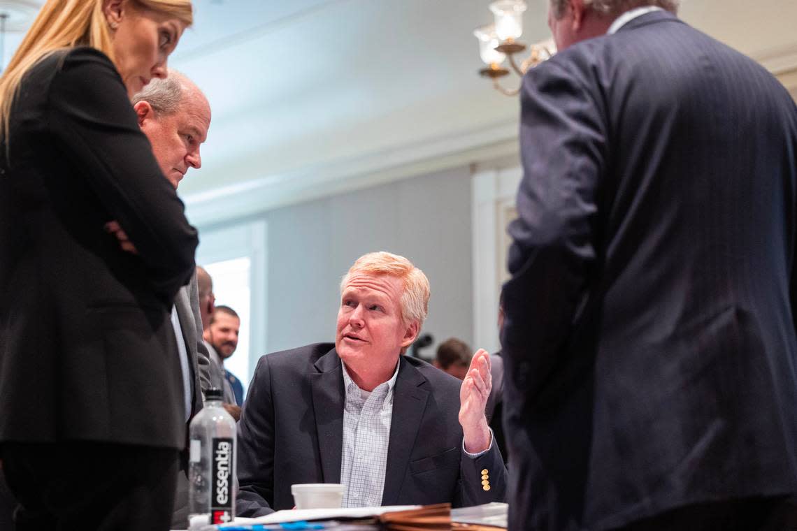 Alex Murdaugh speaks with his attorneys during his trial for murder at the Colleton County Courthouse on Tuesday, Feb. 14, 2023. Joshua Boucher/The State/Pool