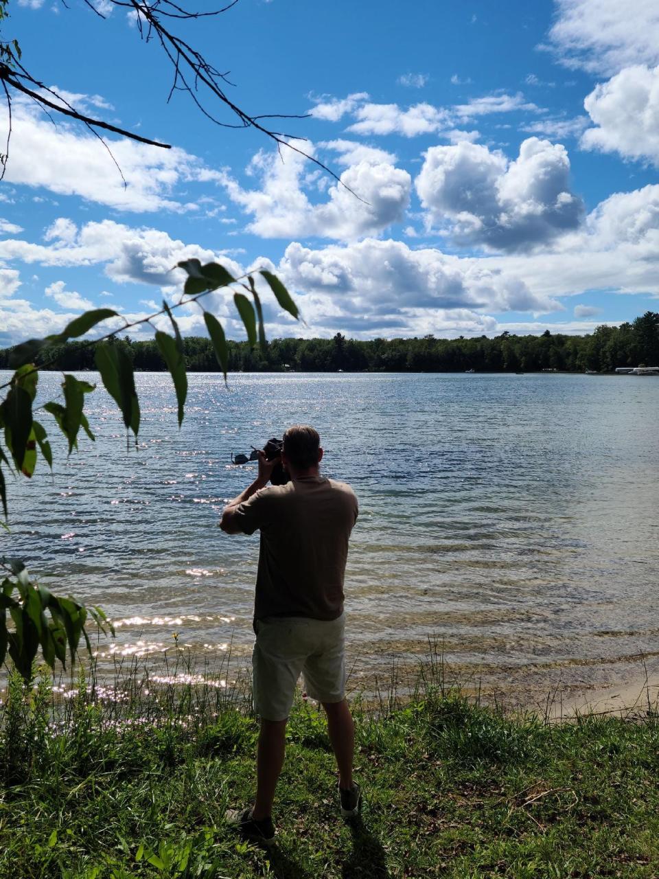 This photo, taken by an FBI confidential informant who was posing as a member of the group, shows accused ringleader Adam Fox photographing the lake area near Gov. Gretchen WhitmerÕs family cottage in northern Michigan.