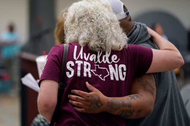 A family member of a shooting victim, who did not wish to share their name, was greeted by a friend following a Uvalde city council meeting in July. (Photo: Eric Gay via Associated Press)
