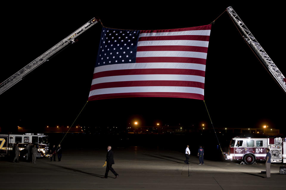 <p>An American flag hangs from firetruck ladders prior to the arrival of Secretary of State Mike Pompeo and three American citizens, released from detention in North Korea, at Joint Base Andrews, Md., on Thursday, May 10, 2018. (Photo: Andrew Harrer/Bloomberg via Getty Images) </p>