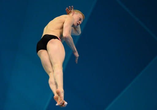 Russia's llya Zakharov competes in the men's 3m springboard final during the diving event at the London 2012 Olympic Games in London. Zakharov of Russia won the men's 3m springboard diving gold medal at the Olympics