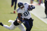 Tennessee Titans tight end Jonnu Smith (81) catches a pass ahead of Jacksonville Jaguars safety Andrew Wingard (42) for a 63-yard gain in the first half of an NFL football game Sunday, Sept. 20, 2020, in Nashville, Tenn. (AP Photo/Wade Payne)