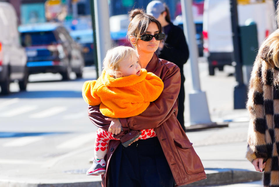 emily carrying her son outisde