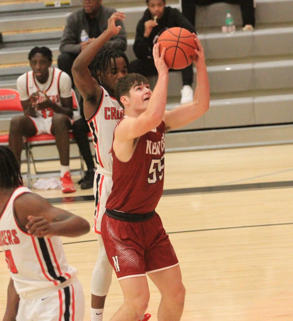 Newark's Austin Rose attempts a shot against Groveport on Tuesday.