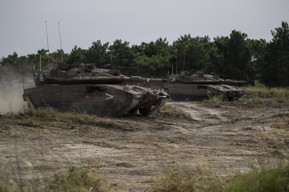 In this Wednesday, May 13, 2020 photo, the Israeli military conduct a drills in northern Israel. Twenty years after Hezbollah guerrillas pushed Israel’s last troops from southern Lebanon, both sides are gearing up for a war that neither seems to want. Israeli troops are drilling for a possible invasion of Lebanon and striking Hezbollah targets in neighboring Syria. Hezbollah is beefing up its own forces and threatening to invade Israel. (AP Photo/Tsafrir Abayov)